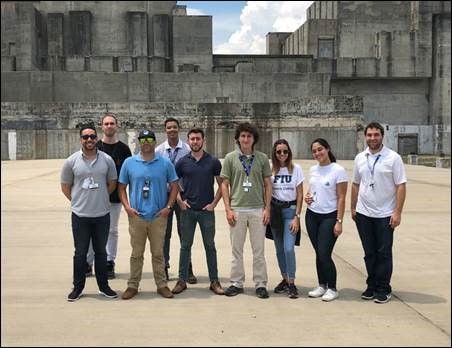 FIU, UT-Austin and University of Puerto Rico student interns in front of the SRS P-Reactor